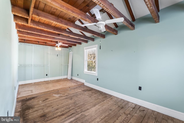 basement featuring wood ceiling, hardwood / wood-style flooring, and ceiling fan