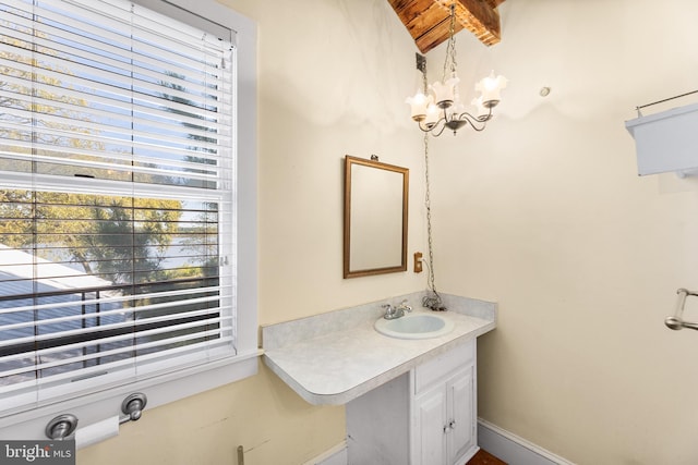 bathroom featuring vanity and a chandelier