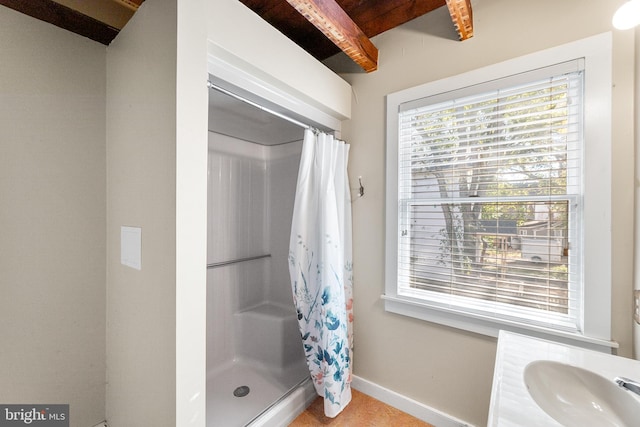 bathroom with vanity and walk in shower