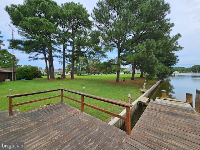 exterior space featuring a water view and a lawn