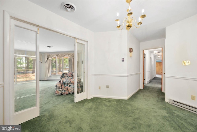 unfurnished room featuring a baseboard heating unit, carpet flooring, visible vents, baseboards, and an inviting chandelier