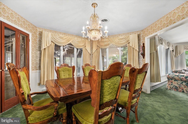 dining room with wallpapered walls, visible vents, a baseboard radiator, an inviting chandelier, and carpet flooring