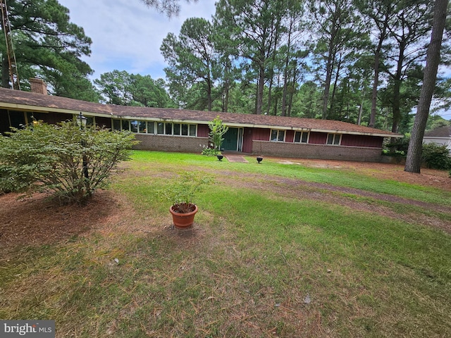 exterior space with a front lawn