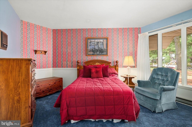 bedroom with a baseboard heating unit, carpet flooring, and wallpapered walls