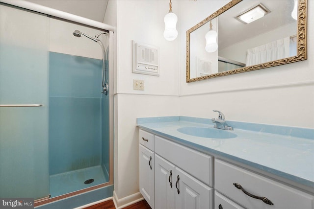 bathroom with vanity and walk in shower