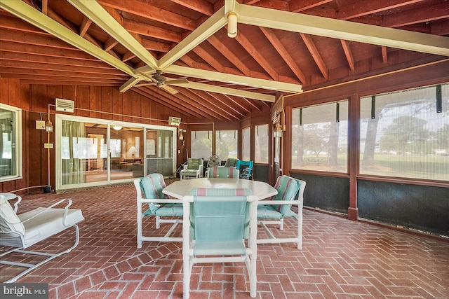 sunroom featuring a ceiling fan and vaulted ceiling