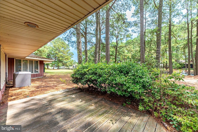 wooden terrace featuring central AC unit