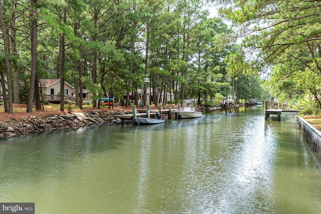 property view of water featuring a boat dock