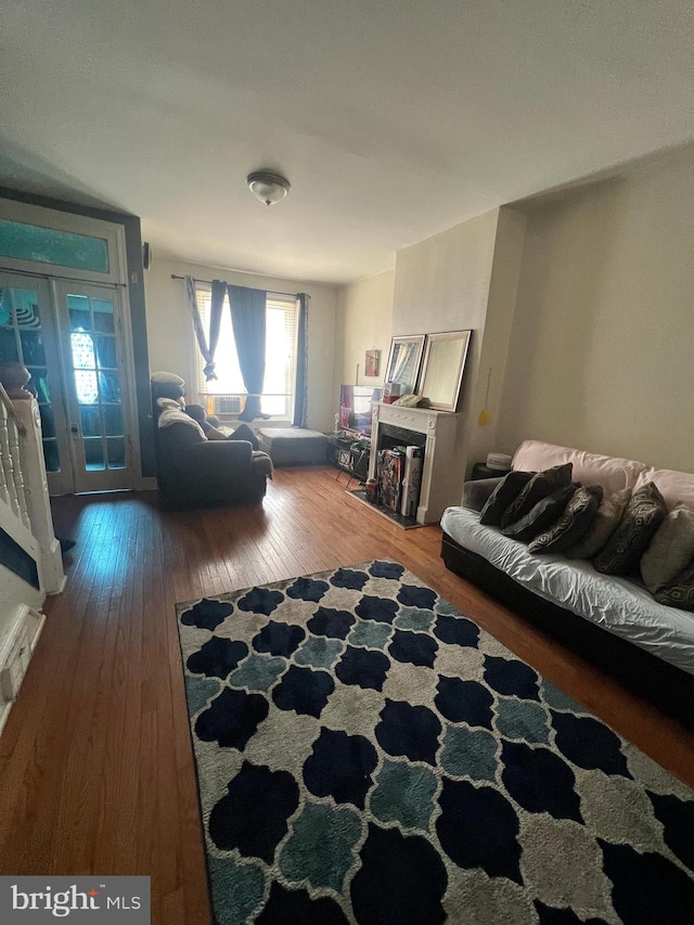 living room with french doors and hardwood / wood-style flooring