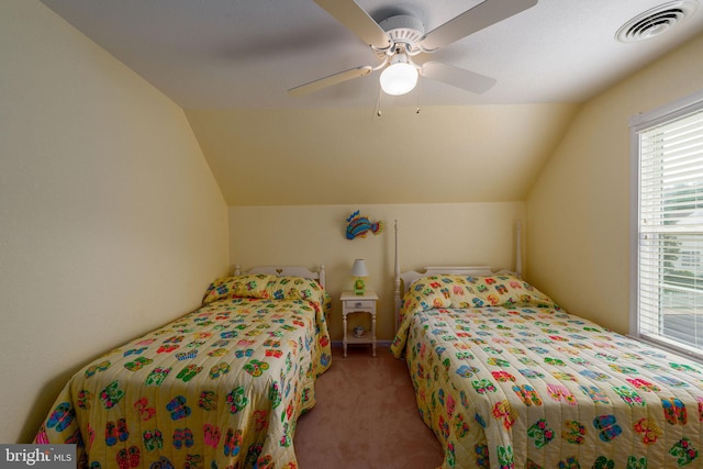 bedroom featuring carpet, lofted ceiling, and ceiling fan