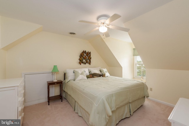 carpeted bedroom with ceiling fan and lofted ceiling