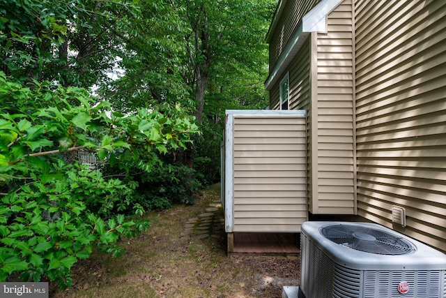 view of side of property featuring central AC