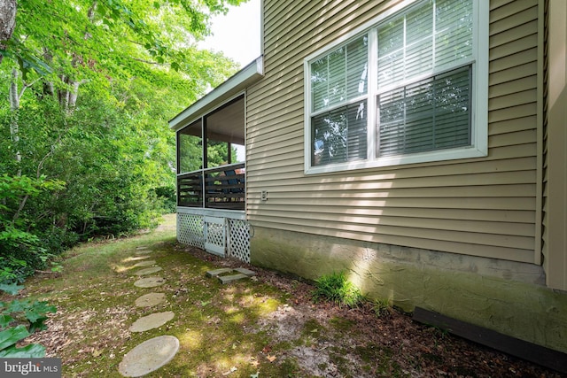 view of home's exterior featuring a sunroom