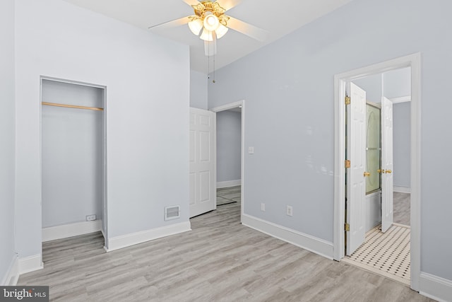 unfurnished bedroom featuring a closet, visible vents, light wood-style flooring, ensuite bath, and baseboards