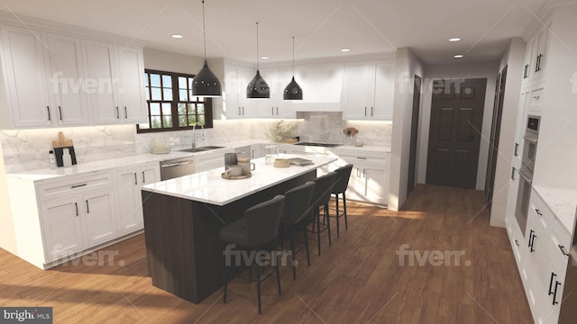 kitchen with stainless steel dishwasher, a breakfast bar area, a sink, and white cabinetry