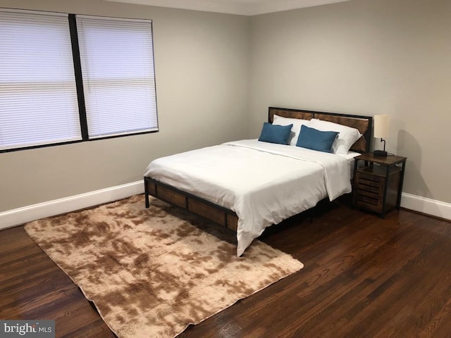 bedroom featuring dark hardwood / wood-style flooring