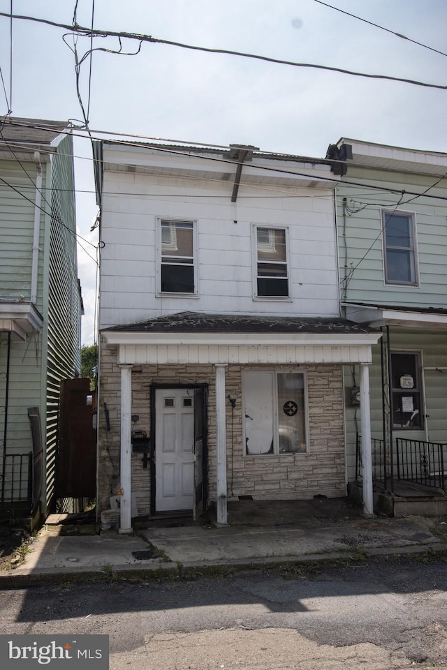 multi unit property featuring a porch