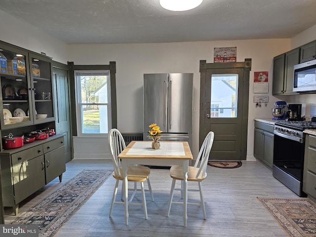 dining room with light hardwood / wood-style flooring