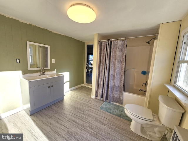 full bathroom with shower / tub combo with curtain, vanity, and toilet