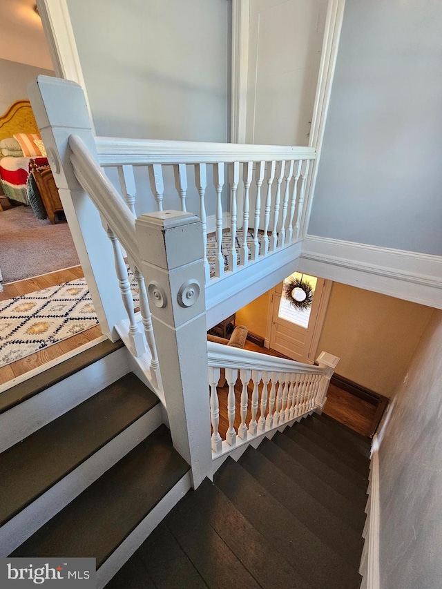 stairway with wood-type flooring