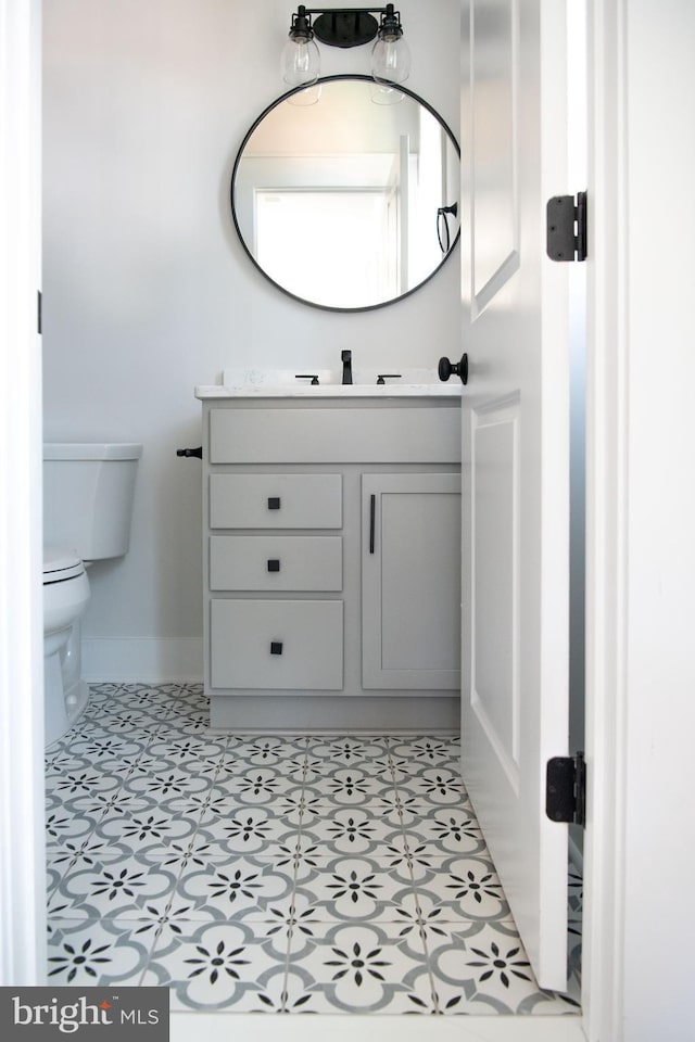 bathroom with vanity and toilet