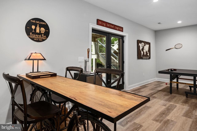 dining space featuring wood-type flooring