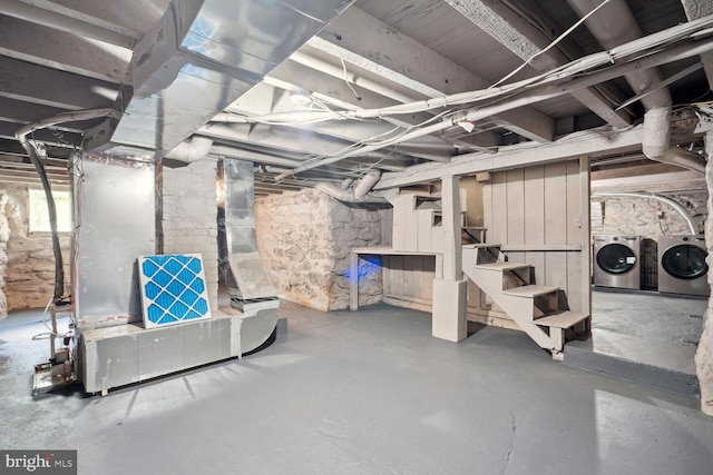 basement featuring washer and clothes dryer