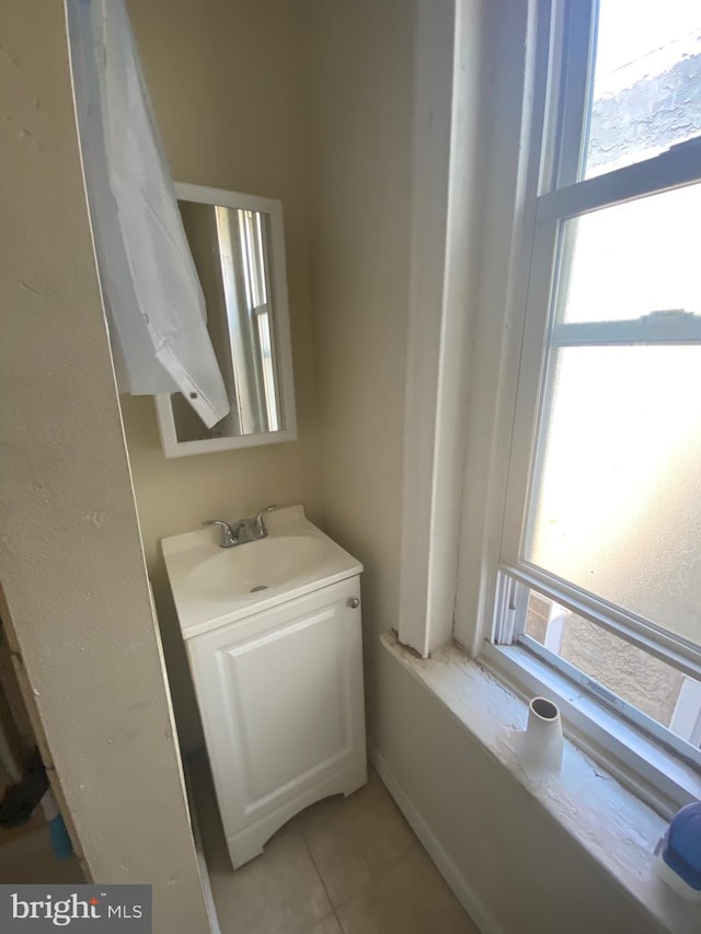 bathroom with vanity and tile patterned flooring