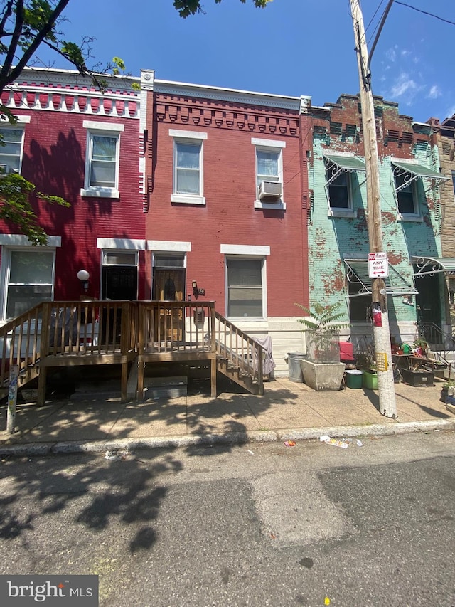 view of front of home with cooling unit and a deck