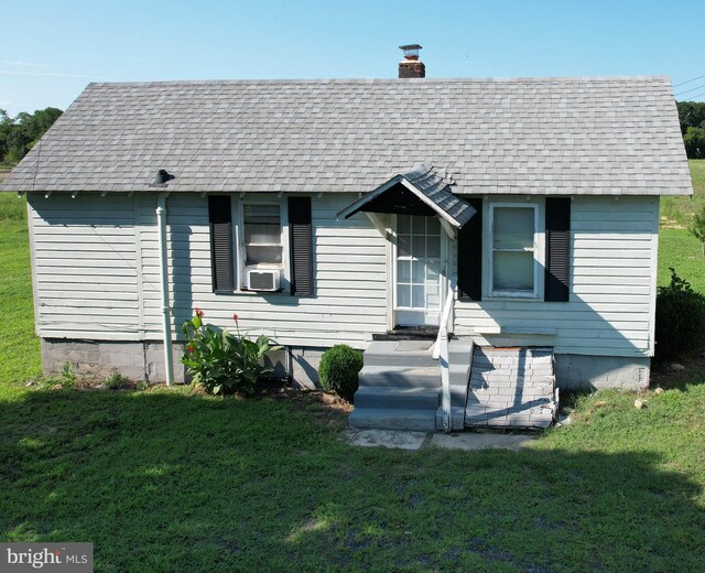 exterior space with a yard and a garage