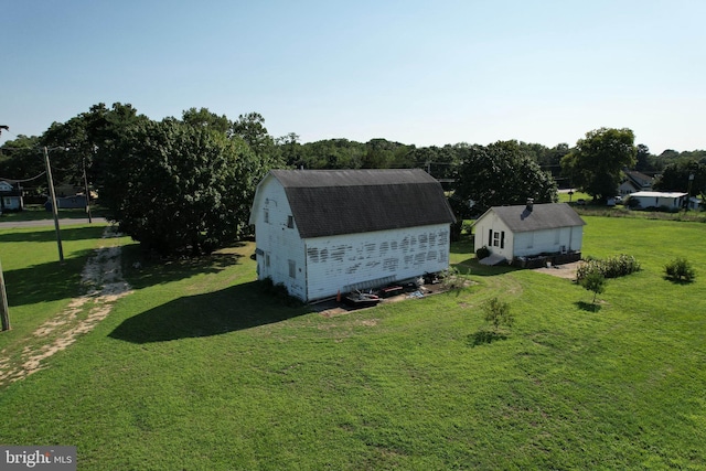 view of outdoor structure featuring a lawn