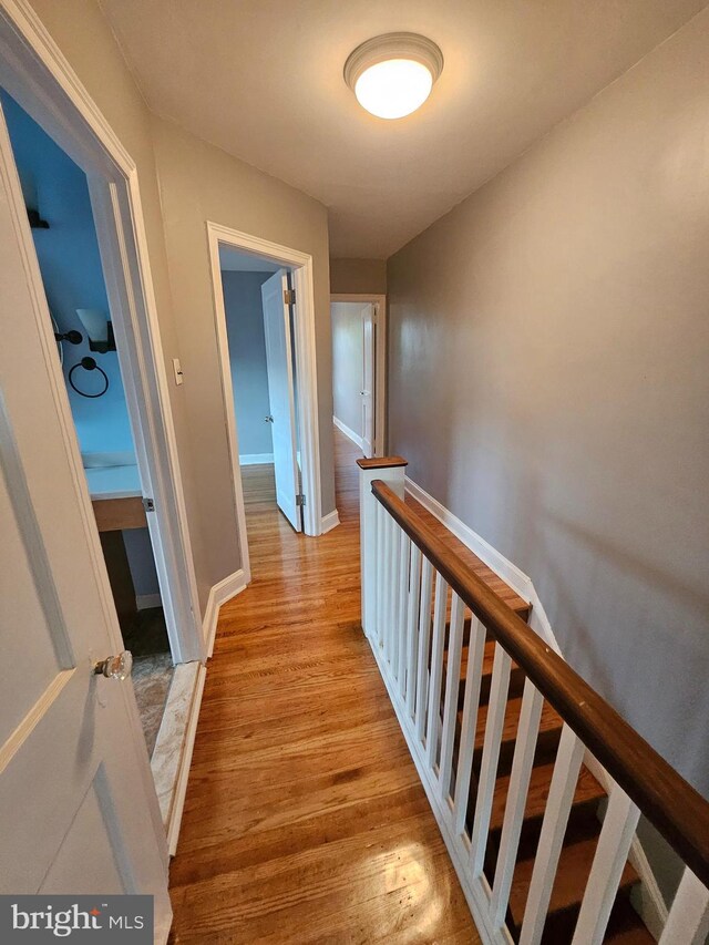 hall with light wood-type flooring