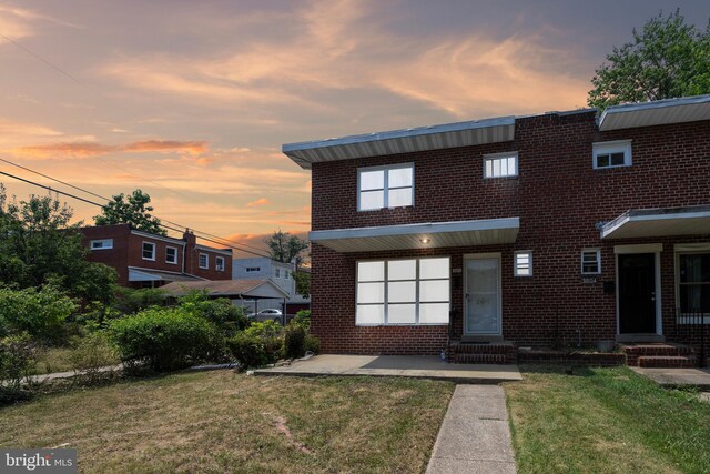 view of front of home with a lawn