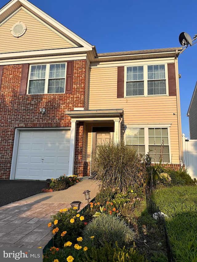 view of front of property with a garage