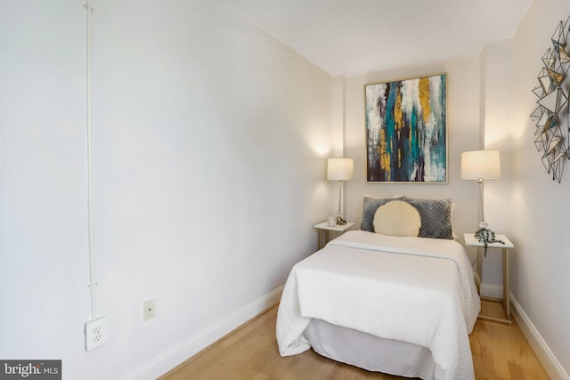 bedroom featuring hardwood / wood-style floors