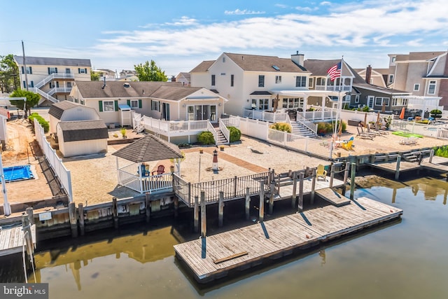 dock area featuring a gazebo and a water view