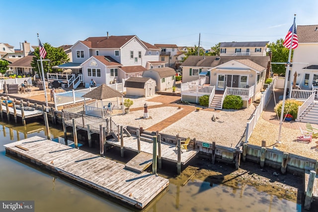 view of dock with a deck with water view