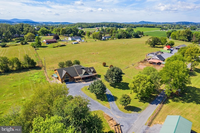 birds eye view of property featuring a rural view