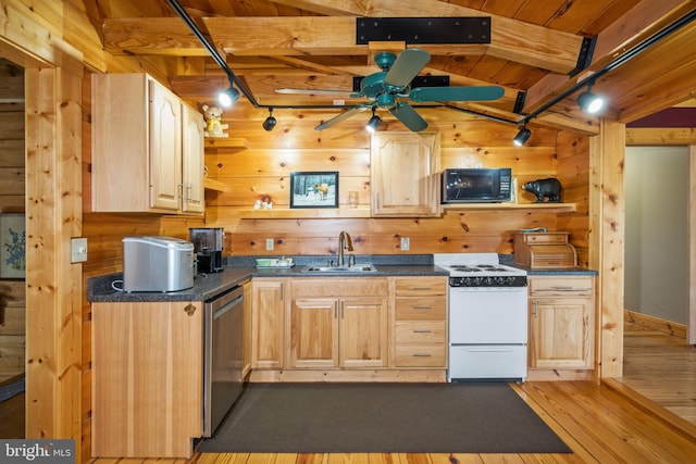 kitchen with wooden walls, a sink, black microwave, dishwasher, and white range with electric stovetop