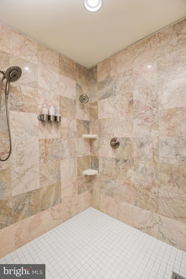 bathroom with a tile shower