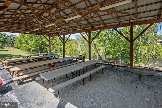 view of community featuring a patio and outdoor dining area