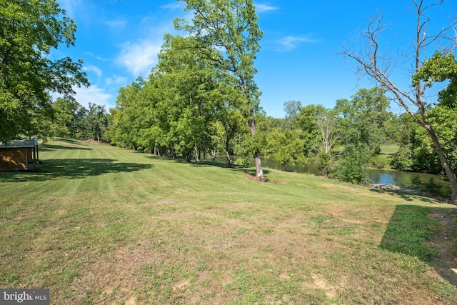 view of yard with a water view