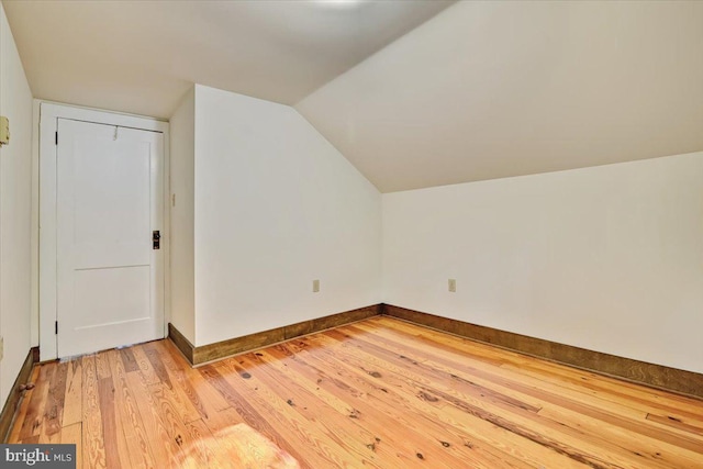 bonus room featuring hardwood / wood-style flooring and lofted ceiling