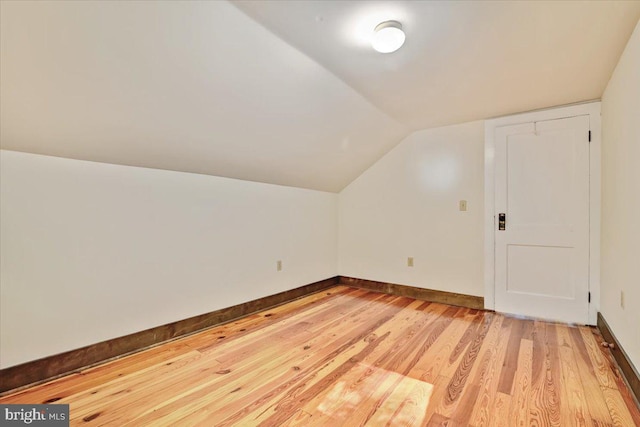 bonus room featuring hardwood / wood-style floors and vaulted ceiling