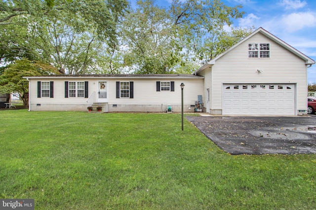 view of front of home with a garage and a front yard