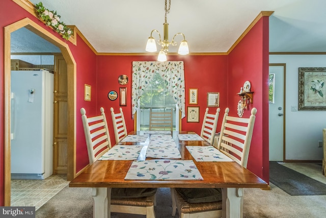 carpeted dining area with an inviting chandelier and crown molding