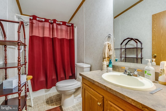 full bathroom featuring toilet, ornamental molding, vanity, and tile patterned floors