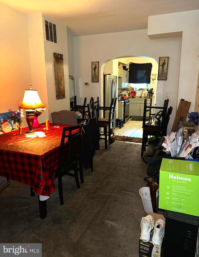 dining room with light carpet