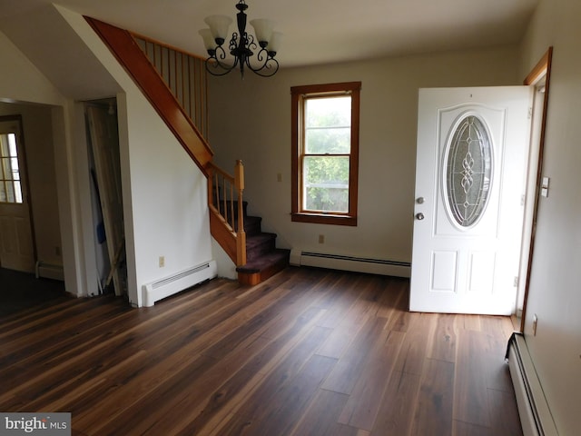 foyer with hardwood / wood-style flooring and baseboard heating