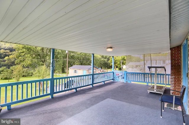 view of patio / terrace featuring a storage unit